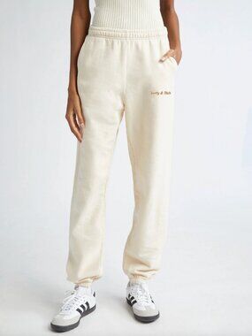 Sporty & Rich Gold Classic Logo Sweatpants in Beige / Cream